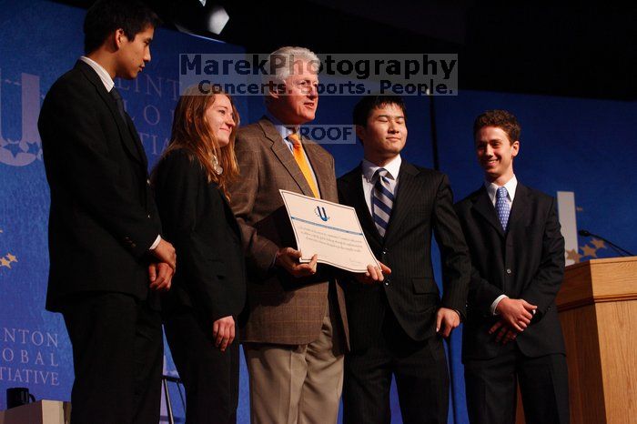 Former President Bill Clinton hands out commitment certificates to CGIU attendees for their exceptional pledges to the CGI cause during the opening plenary session of the CGIU meeting.  Day one of the 2nd Annual Clinton Global Initiative University (CGIU) meeting was held at The University of Texas at Austin, Friday, February 13, 2009.

Filename: SRM_20090213_16473438.jpg
Aperture: f/4.0
Shutter Speed: 1/160
Body: Canon EOS-1D Mark II
Lens: Canon EF 80-200mm f/2.8 L