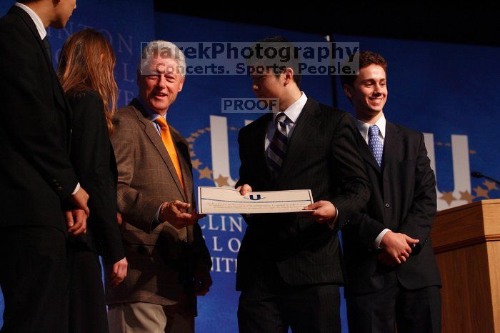 Former President Bill Clinton hands out commitment certificates to CGIU attendees for their exceptional pledges to the CGI cause during the opening plenary session of the CGIU meeting.  Day one of the 2nd Annual Clinton Global Initiative University (CGIU) meeting was held at The University of Texas at Austin, Friday, February 13, 2009.

Filename: SRM_20090213_16473944.jpg
Aperture: f/4.0
Shutter Speed: 1/160
Body: Canon EOS-1D Mark II
Lens: Canon EF 80-200mm f/2.8 L