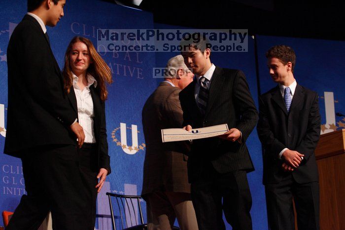 Former President Bill Clinton hands out commitment certificates to CGIU attendees for their exceptional pledges to the CGI cause during the opening plenary session of the CGIU meeting.  Day one of the 2nd Annual Clinton Global Initiative University (CGIU) meeting was held at The University of Texas at Austin, Friday, February 13, 2009.

Filename: SRM_20090213_16473947.jpg
Aperture: f/4.0
Shutter Speed: 1/160
Body: Canon EOS-1D Mark II
Lens: Canon EF 80-200mm f/2.8 L