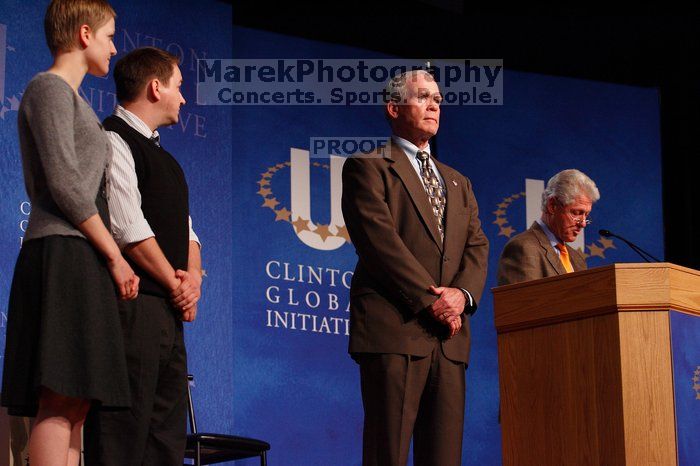 Former President Bill Clinton hands out commitment certificates to CGIU attendees for their exceptional pledges to the CGI cause during the opening plenary session of the CGIU meeting.  Day one of the 2nd Annual Clinton Global Initiative University (CGIU) meeting was held at The University of Texas at Austin, Friday, February 13, 2009.

Filename: SRM_20090213_16481748.jpg
Aperture: f/4.0
Shutter Speed: 1/160
Body: Canon EOS-1D Mark II
Lens: Canon EF 80-200mm f/2.8 L