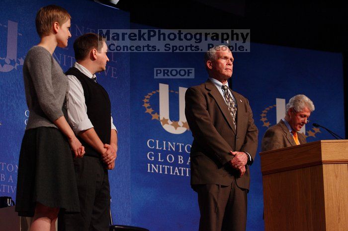 Former President Bill Clinton hands out commitment certificates to CGIU attendees for their exceptional pledges to the CGI cause during the opening plenary session of the CGIU meeting.  Day one of the 2nd Annual Clinton Global Initiative University (CGIU) meeting was held at The University of Texas at Austin, Friday, February 13, 2009.

Filename: SRM_20090213_16482050.jpg
Aperture: f/4.0
Shutter Speed: 1/200
Body: Canon EOS-1D Mark II
Lens: Canon EF 80-200mm f/2.8 L