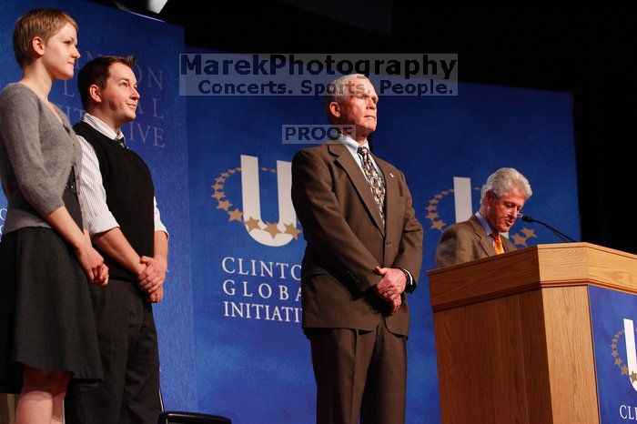 Former President Bill Clinton hands out commitment certificates to CGIU attendees for their exceptional pledges to the CGI cause during the opening plenary session of the CGIU meeting.  Day one of the 2nd Annual Clinton Global Initiative University (CGIU) meeting was held at The University of Texas at Austin, Friday, February 13, 2009.

Filename: SRM_20090213_16484558.jpg
Aperture: f/4.0
Shutter Speed: 1/160
Body: Canon EOS-1D Mark II
Lens: Canon EF 80-200mm f/2.8 L