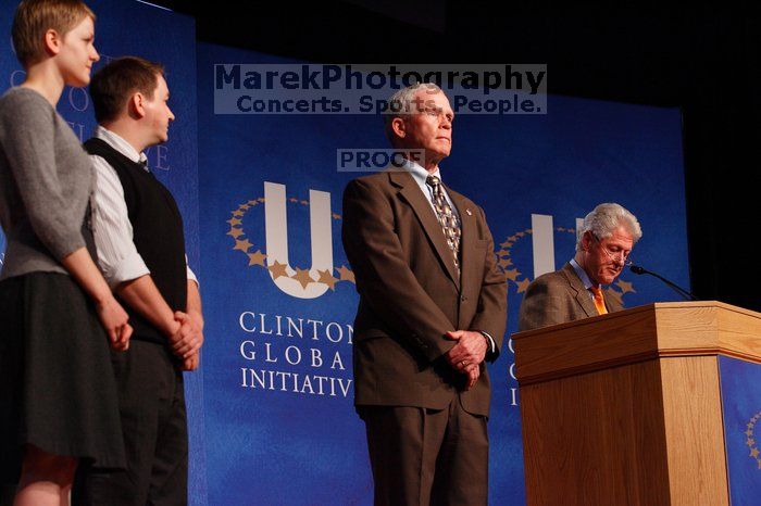 Former President Bill Clinton hands out commitment certificates to CGIU attendees for their exceptional pledges to the CGI cause during the opening plenary session of the CGIU meeting.  Day one of the 2nd Annual Clinton Global Initiative University (CGIU) meeting was held at The University of Texas at Austin, Friday, February 13, 2009.

Filename: SRM_20090213_16490261.jpg
Aperture: f/4.0
Shutter Speed: 1/160
Body: Canon EOS-1D Mark II
Lens: Canon EF 80-200mm f/2.8 L