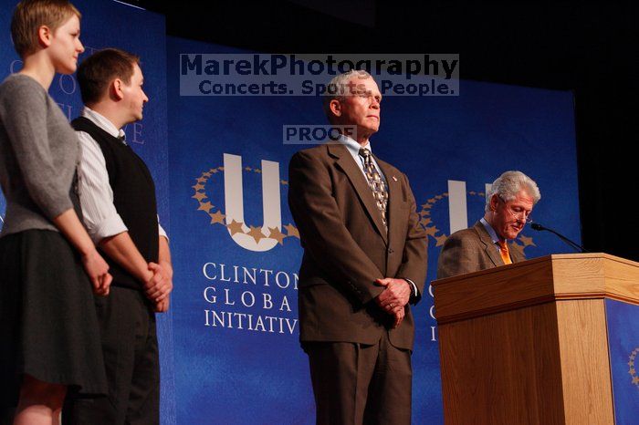 Former President Bill Clinton hands out commitment certificates to CGIU attendees for their exceptional pledges to the CGI cause during the opening plenary session of the CGIU meeting.  Day one of the 2nd Annual Clinton Global Initiative University (CGIU) meeting was held at The University of Texas at Austin, Friday, February 13, 2009.

Filename: SRM_20090213_16490262.jpg
Aperture: f/4.0
Shutter Speed: 1/160
Body: Canon EOS-1D Mark II
Lens: Canon EF 80-200mm f/2.8 L