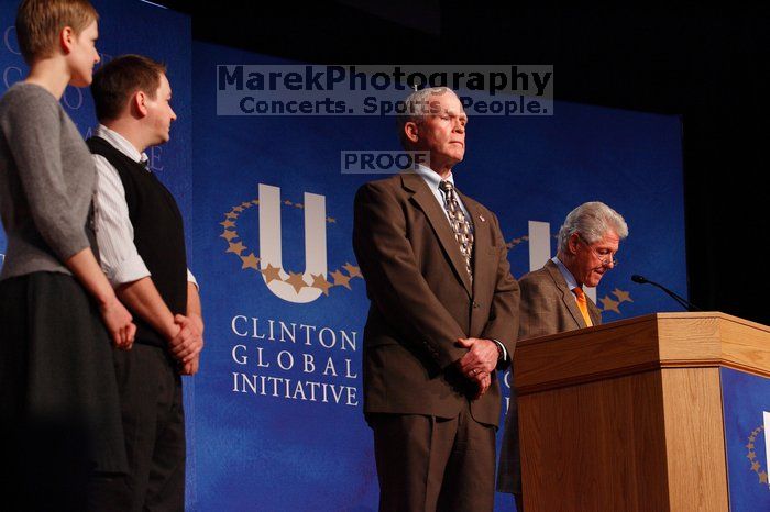 Former President Bill Clinton hands out commitment certificates to CGIU attendees for their exceptional pledges to the CGI cause during the opening plenary session of the CGIU meeting.  Day one of the 2nd Annual Clinton Global Initiative University (CGIU) meeting was held at The University of Texas at Austin, Friday, February 13, 2009.

Filename: SRM_20090213_16491263.jpg
Aperture: f/4.0
Shutter Speed: 1/160
Body: Canon EOS-1D Mark II
Lens: Canon EF 80-200mm f/2.8 L