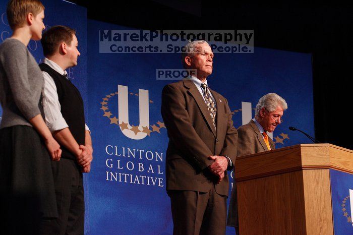 Former President Bill Clinton hands out commitment certificates to CGIU attendees for their exceptional pledges to the CGI cause during the opening plenary session of the CGIU meeting.  Day one of the 2nd Annual Clinton Global Initiative University (CGIU) meeting was held at The University of Texas at Austin, Friday, February 13, 2009.

Filename: SRM_20090213_16491264.jpg
Aperture: f/4.0
Shutter Speed: 1/160
Body: Canon EOS-1D Mark II
Lens: Canon EF 80-200mm f/2.8 L