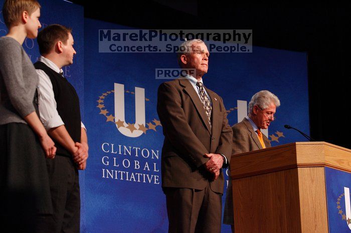 Former President Bill Clinton hands out commitment certificates to CGIU attendees for their exceptional pledges to the CGI cause during the opening plenary session of the CGIU meeting.  Day one of the 2nd Annual Clinton Global Initiative University (CGIU) meeting was held at The University of Texas at Austin, Friday, February 13, 2009.

Filename: SRM_20090213_16491365.jpg
Aperture: f/4.0
Shutter Speed: 1/160
Body: Canon EOS-1D Mark II
Lens: Canon EF 80-200mm f/2.8 L