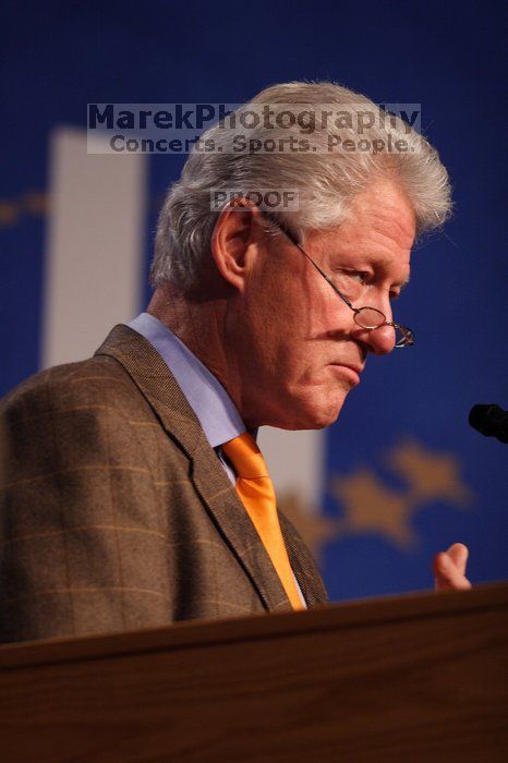 Former President Bill Clinton hands out commitment certificates to CGIU attendees for their exceptional pledges to the CGI cause during the opening plenary session of the CGIU meeting.  Day one of the 2nd Annual Clinton Global Initiative University (CGIU) meeting was held at The University of Texas at Austin, Friday, February 13, 2009.

Filename: SRM_20090213_16495524.jpg
Aperture: f/2.8
Shutter Speed: 1/250
Body: Canon EOS 20D
Lens: Canon EF 300mm f/2.8 L IS