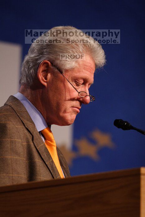 Former President Bill Clinton hands out commitment certificates to CGIU attendees for their exceptional pledges to the CGI cause during the opening plenary session of the CGIU meeting.  Day one of the 2nd Annual Clinton Global Initiative University (CGIU) meeting was held at The University of Texas at Austin, Friday, February 13, 2009.

Filename: SRM_20090213_16495525.jpg
Aperture: f/2.8
Shutter Speed: 1/250
Body: Canon EOS 20D
Lens: Canon EF 300mm f/2.8 L IS