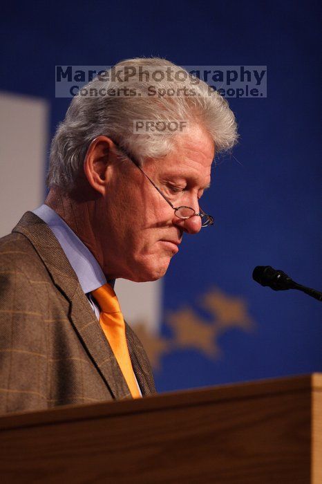 Former President Bill Clinton hands out commitment certificates to CGIU attendees for their exceptional pledges to the CGI cause during the opening plenary session of the CGIU meeting.  Day one of the 2nd Annual Clinton Global Initiative University (CGIU) meeting was held at The University of Texas at Austin, Friday, February 13, 2009.

Filename: SRM_20090213_16495626.jpg
Aperture: f/2.8
Shutter Speed: 1/250
Body: Canon EOS 20D
Lens: Canon EF 300mm f/2.8 L IS