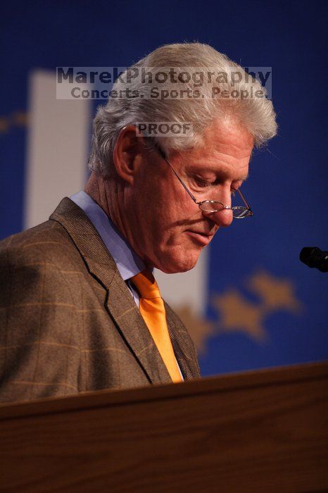 Former President Bill Clinton hands out commitment certificates to CGIU attendees for their exceptional pledges to the CGI cause during the opening plenary session of the CGIU meeting.  Day one of the 2nd Annual Clinton Global Initiative University (CGIU) meeting was held at The University of Texas at Austin, Friday, February 13, 2009.

Filename: SRM_20090213_16495927.jpg
Aperture: f/2.8
Shutter Speed: 1/250
Body: Canon EOS 20D
Lens: Canon EF 300mm f/2.8 L IS