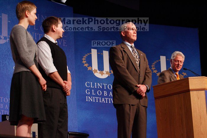 Former President Bill Clinton hands out commitment certificates to CGIU attendees for their exceptional pledges to the CGI cause during the opening plenary session of the CGIU meeting.  Day one of the 2nd Annual Clinton Global Initiative University (CGIU) meeting was held at The University of Texas at Austin, Friday, February 13, 2009.

Filename: SRM_20090213_16501867.jpg
Aperture: f/4.0
Shutter Speed: 1/160
Body: Canon EOS-1D Mark II
Lens: Canon EF 80-200mm f/2.8 L