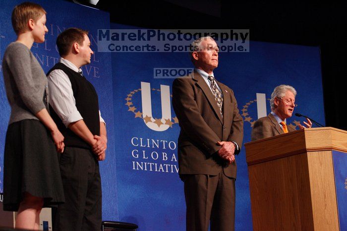 Former President Bill Clinton hands out commitment certificates to CGIU attendees for their exceptional pledges to the CGI cause during the opening plenary session of the CGIU meeting.  Day one of the 2nd Annual Clinton Global Initiative University (CGIU) meeting was held at The University of Texas at Austin, Friday, February 13, 2009.

Filename: SRM_20090213_16502770.jpg
Aperture: f/4.0
Shutter Speed: 1/160
Body: Canon EOS-1D Mark II
Lens: Canon EF 80-200mm f/2.8 L