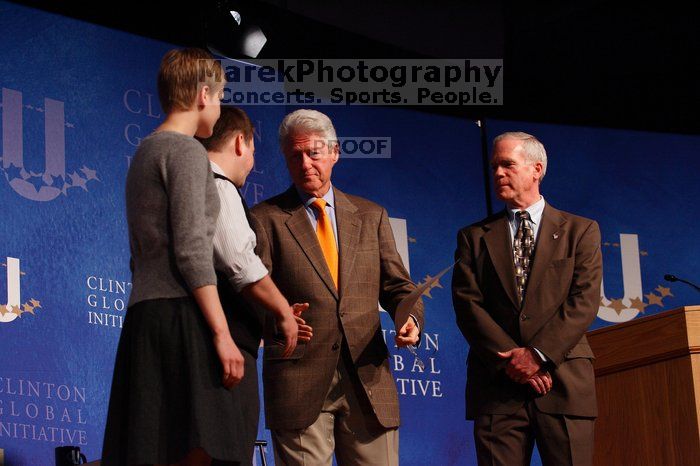 Former President Bill Clinton hands out commitment certificates to CGIU attendees for their exceptional pledges to the CGI cause during the opening plenary session of the CGIU meeting.  Day one of the 2nd Annual Clinton Global Initiative University (CGIU) meeting was held at The University of Texas at Austin, Friday, February 13, 2009.

Filename: SRM_20090213_16504772.jpg
Aperture: f/4.0
Shutter Speed: 1/160
Body: Canon EOS-1D Mark II
Lens: Canon EF 80-200mm f/2.8 L