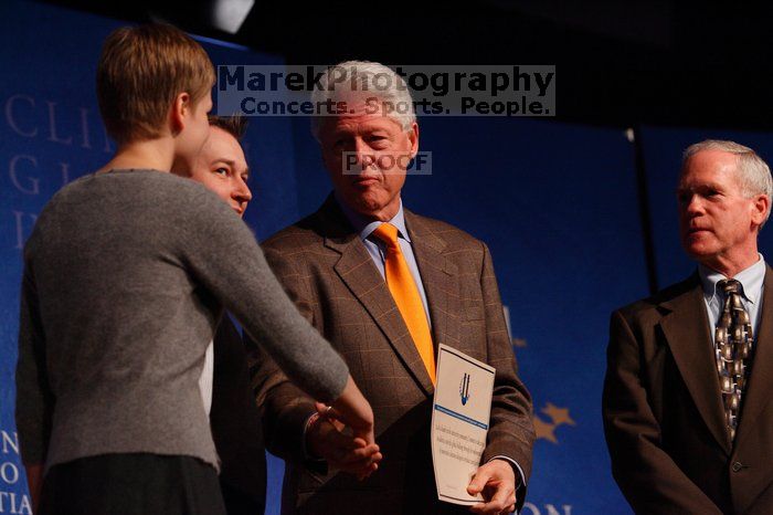 Former President Bill Clinton hands out commitment certificates to CGIU attendees for their exceptional pledges to the CGI cause during the opening plenary session of the CGIU meeting.  Day one of the 2nd Annual Clinton Global Initiative University (CGIU) meeting was held at The University of Texas at Austin, Friday, February 13, 2009.

Filename: SRM_20090213_16504978.jpg
Aperture: f/4.0
Shutter Speed: 1/200
Body: Canon EOS-1D Mark II
Lens: Canon EF 80-200mm f/2.8 L