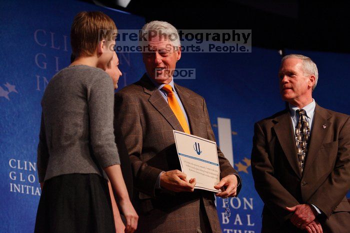 Former President Bill Clinton hands out commitment certificates to CGIU attendees for their exceptional pledges to the CGI cause during the opening plenary session of the CGIU meeting.  Day one of the 2nd Annual Clinton Global Initiative University (CGIU) meeting was held at The University of Texas at Austin, Friday, February 13, 2009.

Filename: SRM_20090213_16505181.jpg
Aperture: f/4.0
Shutter Speed: 1/200
Body: Canon EOS-1D Mark II
Lens: Canon EF 80-200mm f/2.8 L