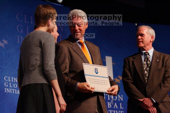 Former President Bill Clinton hands out commitment certificates to CGIU attendees for their exceptional pledges to the CGI cause during the opening plenary session of the CGIU meeting.  Day one of the 2nd Annual Clinton Global Initiative University (CGIU) meeting was held at The University of Texas at Austin, Friday, February 13, 2009.

Filename: SRM_20090213_16505182.jpg
Aperture: f/4.0
Shutter Speed: 1/200
Body: Canon EOS-1D Mark II
Lens: Canon EF 80-200mm f/2.8 L