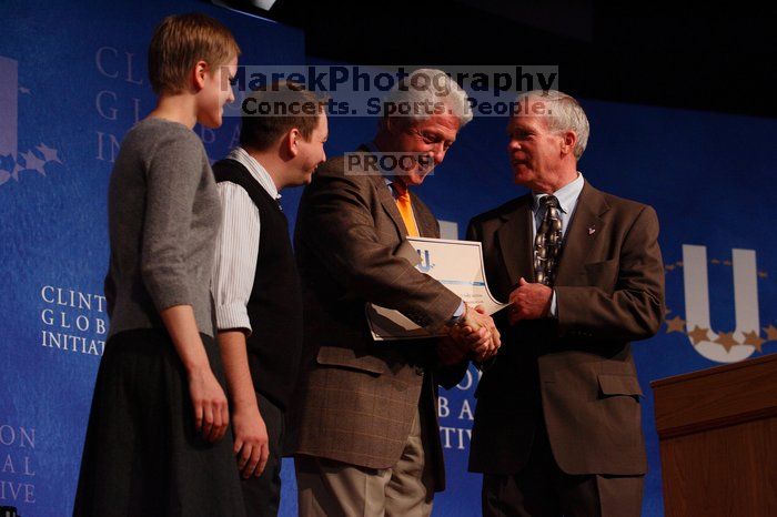 Former President Bill Clinton hands out commitment certificates to CGIU attendees for their exceptional pledges to the CGI cause during the opening plenary session of the CGIU meeting.  Day one of the 2nd Annual Clinton Global Initiative University (CGIU) meeting was held at The University of Texas at Austin, Friday, February 13, 2009.

Filename: SRM_20090213_16505485.jpg
Aperture: f/4.0
Shutter Speed: 1/200
Body: Canon EOS-1D Mark II
Lens: Canon EF 80-200mm f/2.8 L