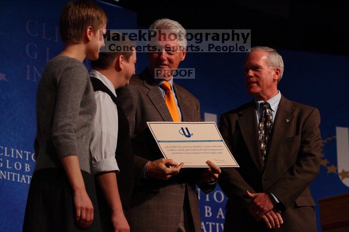 Former President Bill Clinton hands out commitment certificates to CGIU attendees for their exceptional pledges to the CGI cause during the opening plenary session of the CGIU meeting.  Day one of the 2nd Annual Clinton Global Initiative University (CGIU) meeting was held at The University of Texas at Austin, Friday, February 13, 2009.

Filename: SRM_20090213_16505586.jpg
Aperture: f/4.0
Shutter Speed: 1/320
Body: Canon EOS-1D Mark II
Lens: Canon EF 80-200mm f/2.8 L