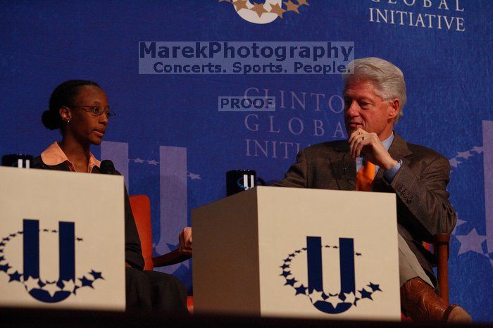 Mambidzeni Madzivire (L), BME graduate student at Mayo Graduate School, and Former President Bill Clinton (R) at the opening plenary session of the CGIU meeting.  Day one of the 2nd Annual Clinton Global Initiative University (CGIU) meeting was held at The University of Texas at Austin, Friday, February 13, 2009.

Filename: SRM_20090213_16580847.jpg
Aperture: f/4.5
Shutter Speed: 1/320
Body: Canon EOS-1D Mark II
Lens: Canon EF 80-200mm f/2.8 L