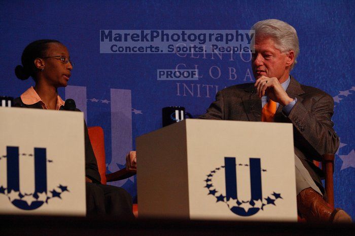 Mambidzeni Madzivire (L), BME graduate student at Mayo Graduate School, and Former President Bill Clinton (R) at the opening plenary session of the CGIU meeting.  Day one of the 2nd Annual Clinton Global Initiative University (CGIU) meeting was held at The University of Texas at Austin, Friday, February 13, 2009.

Filename: SRM_20090213_16581248.jpg
Aperture: f/4.5
Shutter Speed: 1/320
Body: Canon EOS-1D Mark II
Lens: Canon EF 80-200mm f/2.8 L