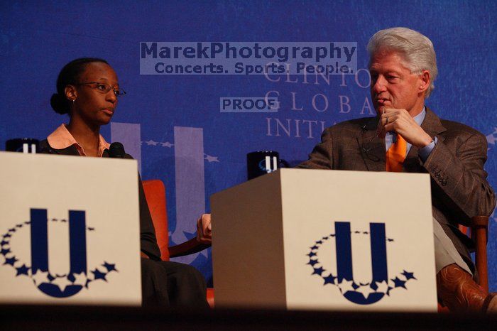 Mambidzeni Madzivire (L), BME graduate student at Mayo Graduate School, and Former President Bill Clinton (R) at the opening plenary session of the CGIU meeting.  Day one of the 2nd Annual Clinton Global Initiative University (CGIU) meeting was held at The University of Texas at Austin, Friday, February 13, 2009.

Filename: SRM_20090213_16581750.jpg
Aperture: f/4.5
Shutter Speed: 1/250
Body: Canon EOS-1D Mark II
Lens: Canon EF 80-200mm f/2.8 L