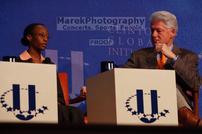 Mambidzeni Madzivire (L), BME graduate student at Mayo Graduate School, and Former President Bill Clinton (R) at the opening plenary session of the CGIU meeting.  Day one of the 2nd Annual Clinton Global Initiative University (CGIU) meeting was held at The University of Texas at Austin, Friday, February 13, 2009.

Filename: SRM_20090213_16581751.jpg
Aperture: f/4.5
Shutter Speed: 1/250
Body: Canon EOS-1D Mark II
Lens: Canon EF 80-200mm f/2.8 L