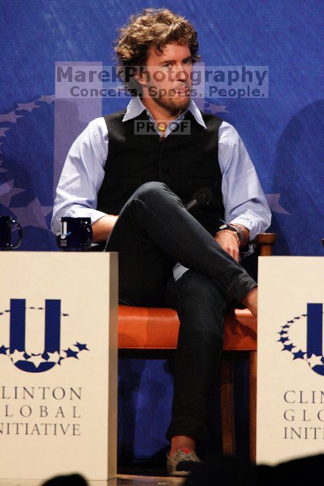 Blake Mycoskie, founder of TOMS shoes, donates one pair of shoes to a third world country for every pair of shoes they sell.  Day one of the 2nd Annual Clinton Global Initiative University (CGIU) meeting was held at The University of Texas at Austin, Friday, February 13, 2009.

Filename: SRM_20090213_17093364.jpg
Aperture: f/5.6
Shutter Speed: 1/250
Body: Canon EOS 20D
Lens: Canon EF 300mm f/2.8 L IS