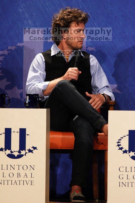 Blake Mycoskie, founder of TOMS shoes, donates one pair of shoes to a third world country for every pair of shoes they sell.  Day one of the 2nd Annual Clinton Global Initiative University (CGIU) meeting was held at The University of Texas at Austin, Friday, February 13, 2009.

Filename: SRM_20090213_17103872.jpg
Aperture: f/5.6
Shutter Speed: 1/250
Body: Canon EOS 20D
Lens: Canon EF 300mm f/2.8 L IS