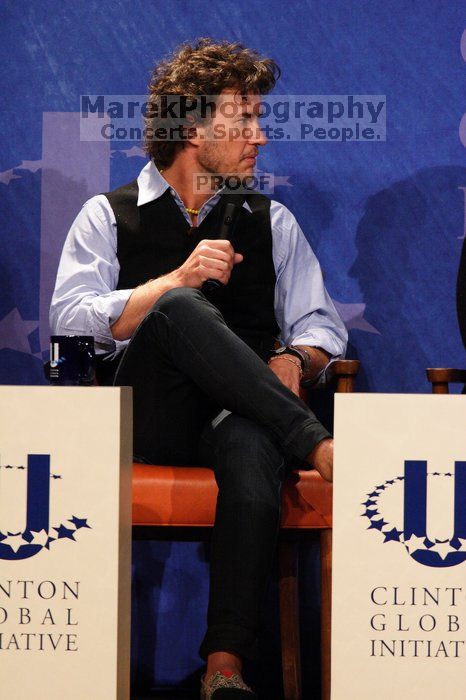 Blake Mycoskie, founder of TOMS shoes, donates one pair of shoes to a third world country for every pair of shoes they sell.  Day one of the 2nd Annual Clinton Global Initiative University (CGIU) meeting was held at The University of Texas at Austin, Friday, February 13, 2009.

Filename: SRM_20090213_17103973.jpg
Aperture: f/5.6
Shutter Speed: 1/250
Body: Canon EOS 20D
Lens: Canon EF 300mm f/2.8 L IS