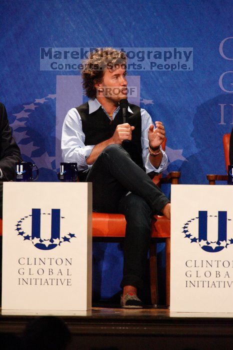 Blake Mycoskie, founder of TOMS shoes, donates one pair of shoes to a third world country for every pair of shoes they sell.  Day one of the 2nd Annual Clinton Global Initiative University (CGIU) meeting was held at The University of Texas at Austin, Friday, February 13, 2009.

Filename: SRM_20090213_17123570.jpg
Aperture: f/5.6
Shutter Speed: 1/250
Body: Canon EOS-1D Mark II
Lens: Canon EF 300mm f/2.8 L IS