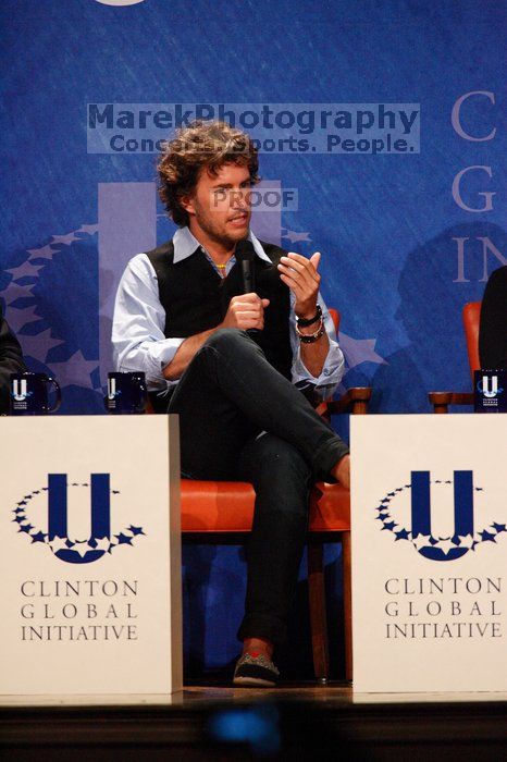 Blake Mycoskie, founder of TOMS shoes, donates one pair of shoes to a third world country for every pair of shoes they sell.  Day one of the 2nd Annual Clinton Global Initiative University (CGIU) meeting was held at The University of Texas at Austin, Friday, February 13, 2009.

Filename: SRM_20090213_17131478.jpg
Aperture: f/5.6
Shutter Speed: 1/250
Body: Canon EOS-1D Mark II
Lens: Canon EF 300mm f/2.8 L IS