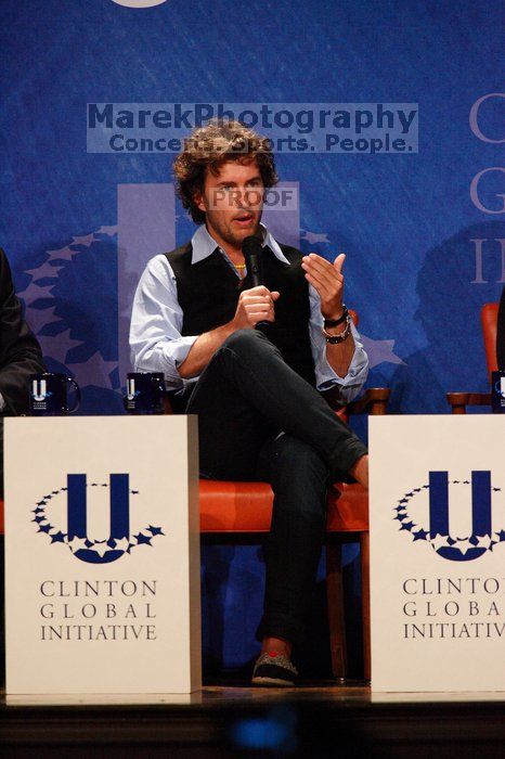 Blake Mycoskie, founder of TOMS shoes, donates one pair of shoes to a third world country for every pair of shoes they sell.  Day one of the 2nd Annual Clinton Global Initiative University (CGIU) meeting was held at The University of Texas at Austin, Friday, February 13, 2009.

Filename: SRM_20090213_17131881.jpg
Aperture: f/5.6
Shutter Speed: 1/320
Body: Canon EOS-1D Mark II
Lens: Canon EF 300mm f/2.8 L IS