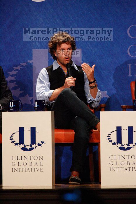 Blake Mycoskie, founder of TOMS shoes, donates one pair of shoes to a third world country for every pair of shoes they sell.  Day one of the 2nd Annual Clinton Global Initiative University (CGIU) meeting was held at The University of Texas at Austin, Friday, February 13, 2009.

Filename: SRM_20090213_17131882.jpg
Aperture: f/5.6
Shutter Speed: 1/320
Body: Canon EOS-1D Mark II
Lens: Canon EF 300mm f/2.8 L IS