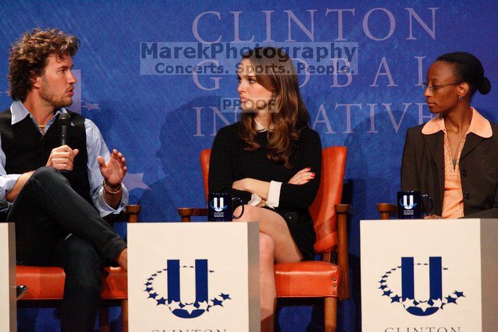 Blake Mycoskie (L), founder of TOMS shoes, Natalie Portman (C), and Mambidzeni Madzivire (R), BME graduate student at Mayo Graduate School, at the first plenary session of the CGIU meeting.  Day one of the 2nd Annual Clinton Global Initiative University (CGIU) meeting was held at The University of Texas at Austin, Friday, February 13, 2009.

Filename: SRM_20090213_17134086.jpg
Aperture: f/5.6
Shutter Speed: 1/250
Body: Canon EOS-1D Mark II
Lens: Canon EF 300mm f/2.8 L IS