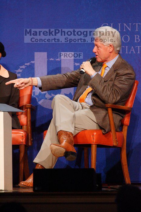 Former President Bill Clinton moderated the discussion between Natalie Portman, Mambidzeni Madzivire, BME graduate student at Mayo Graduate School, Blake Mycoskie, founder of TOMS shoes, and Paul Bell, president of Dell Global Public, during the first plenary session at the CGIU meeting.  Day one of the 2nd Annual Clinton Global Initiative University (CGIU) meeting was held at The University of Texas at Austin, Friday, February 13, 2009.

Filename: SRM_20090213_17150100.jpg
Aperture: f/5.6
Shutter Speed: 1/200
Body: Canon EOS-1D Mark II
Lens: Canon EF 300mm f/2.8 L IS