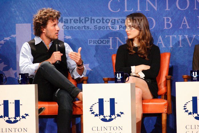 Blake Mycoskie (L), founder of TOMS shoes, and Natalie Portman (R) at the first plenary session of the CGIU meeting.  Day one of the 2nd Annual Clinton Global Initiative University (CGIU) meeting was held at The University of Texas at Austin, Friday, February 13, 2009.

Filename: SRM_20090213_17162308.jpg
Aperture: f/5.6
Shutter Speed: 1/160
Body: Canon EOS-1D Mark II
Lens: Canon EF 300mm f/2.8 L IS