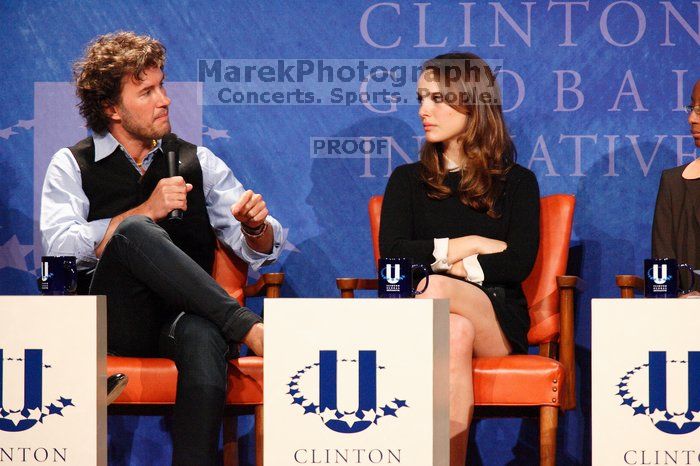 Blake Mycoskie (L), founder of TOMS shoes, and Natalie Portman (R) at the first plenary session of the CGIU meeting.  Day one of the 2nd Annual Clinton Global Initiative University (CGIU) meeting was held at The University of Texas at Austin, Friday, February 13, 2009.

Filename: SRM_20090213_17163309.jpg
Aperture: f/5.6
Shutter Speed: 1/160
Body: Canon EOS-1D Mark II
Lens: Canon EF 300mm f/2.8 L IS