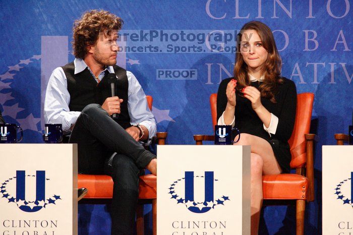 Blake Mycoskie (L), founder of TOMS shoes, and Natalie Portman (R) at the first plenary session of the CGIU meeting.  Day one of the 2nd Annual Clinton Global Initiative University (CGIU) meeting was held at The University of Texas at Austin, Friday, February 13, 2009.

Filename: SRM_20090213_17163712.jpg
Aperture: f/5.6
Shutter Speed: 1/200
Body: Canon EOS-1D Mark II
Lens: Canon EF 300mm f/2.8 L IS