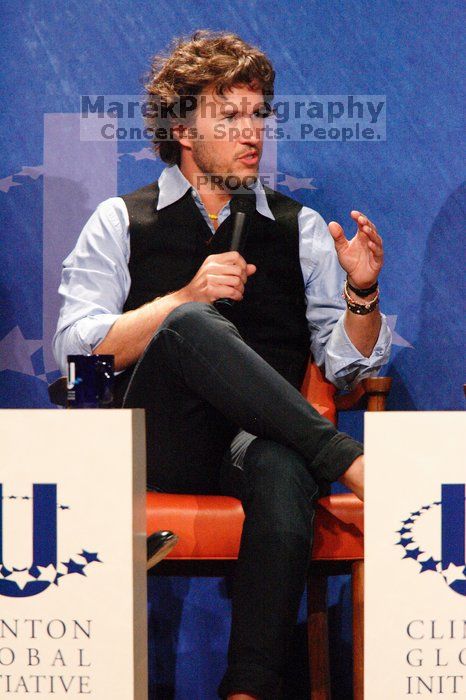 Blake Mycoskie, founder of TOMS shoes, donates one pair of shoes to a third world country for every pair of shoes they sell.  Day one of the 2nd Annual Clinton Global Initiative University (CGIU) meeting was held at The University of Texas at Austin, Friday, February 13, 2009.

Filename: SRM_20090213_17180732.jpg
Aperture: f/5.6
Shutter Speed: 1/200
Body: Canon EOS-1D Mark II
Lens: Canon EF 300mm f/2.8 L IS