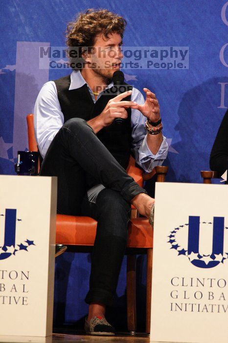 Blake Mycoskie, founder of TOMS shoes, donates one pair of shoes to a third world country for every pair of shoes they sell.  Day one of the 2nd Annual Clinton Global Initiative University (CGIU) meeting was held at The University of Texas at Austin, Friday, February 13, 2009.

Filename: SRM_20090213_17340997.jpg
Aperture: f/5.6
Shutter Speed: 1/200
Body: Canon EOS 20D
Lens: Canon EF 300mm f/2.8 L IS