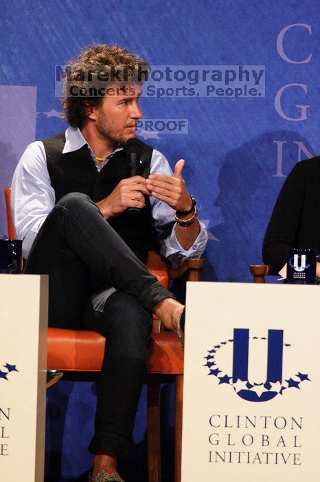 Blake Mycoskie, founder of TOMS shoes, donates one pair of shoes to a third world country for every pair of shoes they sell.  Day one of the 2nd Annual Clinton Global Initiative University (CGIU) meeting was held at The University of Texas at Austin, Friday, February 13, 2009.

Filename: SRM_20090213_17341399.jpg
Aperture: f/5.6
Shutter Speed: 1/200
Body: Canon EOS 20D
Lens: Canon EF 300mm f/2.8 L IS