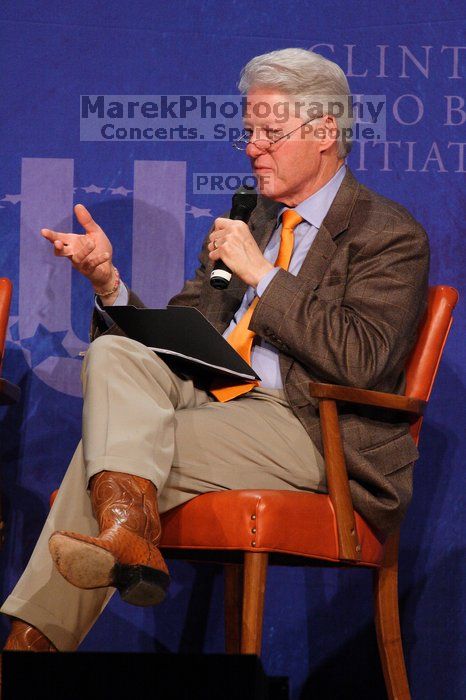 Former President Bill Clinton moderated the discussion between Natalie Portman, Mambidzeni Madzivire, BME graduate student at Mayo Graduate School, Blake Mycoskie, founder of TOMS shoes, and Paul Bell, president of Dell Global Public, during the first plenary session at the CGIU meeting.  Day one of the 2nd Annual Clinton Global Initiative University (CGIU) meeting was held at The University of Texas at Austin, Friday, February 13, 2009.

Filename: SRM_20090213_17361616.jpg
Aperture: f/5.6
Shutter Speed: 1/250
Body: Canon EOS 20D
Lens: Canon EF 300mm f/2.8 L IS