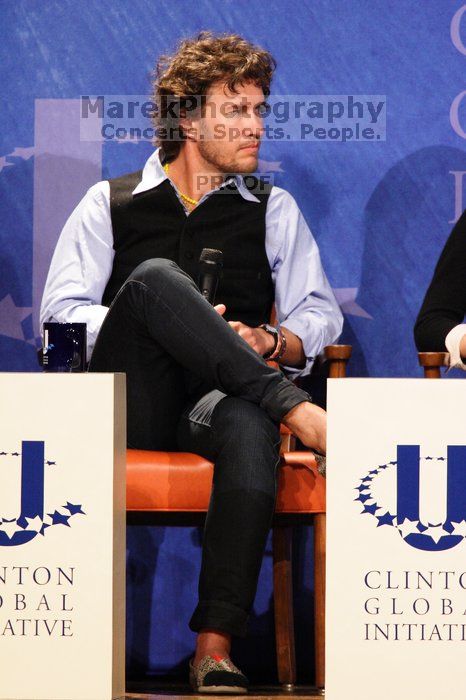 Blake Mycoskie, founder of TOMS shoes, donates one pair of shoes to a third world country for every pair of shoes they sell.  Day one of the 2nd Annual Clinton Global Initiative University (CGIU) meeting was held at The University of Texas at Austin, Friday, February 13, 2009.

Filename: SRM_20090213_17393746.jpg
Aperture: f/5.6
Shutter Speed: 1/160
Body: Canon EOS 20D
Lens: Canon EF 300mm f/2.8 L IS