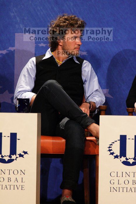 Blake Mycoskie, founder of TOMS shoes, donates one pair of shoes to a third world country for every pair of shoes they sell.  Day one of the 2nd Annual Clinton Global Initiative University (CGIU) meeting was held at The University of Texas at Austin, Friday, February 13, 2009.

Filename: SRM_20090213_17412858.jpg
Aperture: f/5.6
Shutter Speed: 1/250
Body: Canon EOS 20D
Lens: Canon EF 300mm f/2.8 L IS