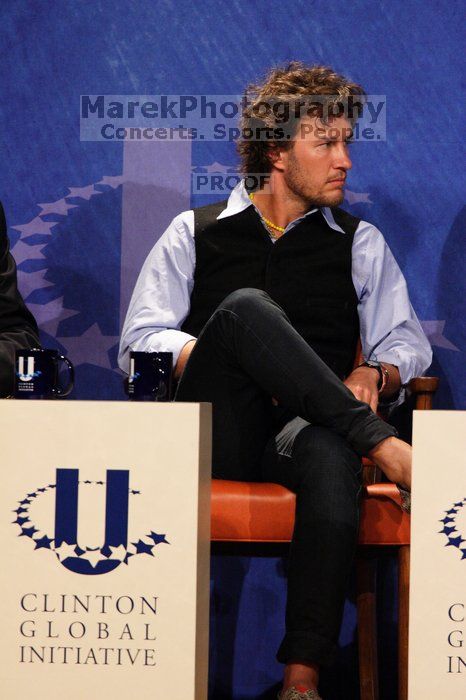 Blake Mycoskie, founder of TOMS shoes, donates one pair of shoes to a third world country for every pair of shoes they sell.  Day one of the 2nd Annual Clinton Global Initiative University (CGIU) meeting was held at The University of Texas at Austin, Friday, February 13, 2009.

Filename: SRM_20090213_17412859.jpg
Aperture: f/5.6
Shutter Speed: 1/250
Body: Canon EOS 20D
Lens: Canon EF 300mm f/2.8 L IS