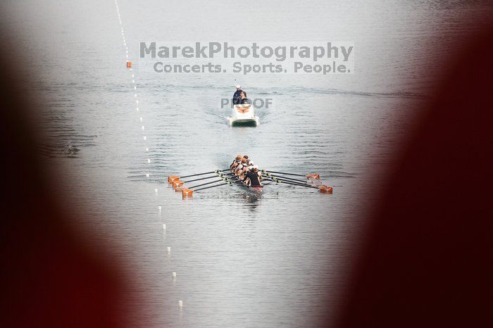 The Texas Rowing first varsity eight team, with coxswain Mary Cait McPherson, stroke Jen VanderMaarel, Felicia Izaguirre-Werner, Meg George, Nancy Arrington, Jelena Zunic, Karli Sheahan, Colleen Irby and Sara Cottingham, finished with a time of 6:44.7, defeating Duke which completed the race in 6:49.9. This was the second session of the Longhorn Invitational, Saturday morning, March 21, 2009 on Lady Bird Lake.  They later won one more race against UCF on Sunday.

Filename: SRM_20090321_08394559.jpg
Aperture: f/2.8
Shutter Speed: 1/2000
Body: Canon EOS-1D Mark II
Lens: Canon EF 300mm f/2.8 L IS