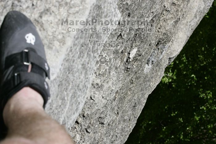 My right foot, as I hang from the top of Ack! (5.11b, but using the crack for the start instead) after top roping it with my camera on my back.  It was another long day of rock climbing at Seismic Wall on Austin's Barton Creek Greenbelt, Sunday, April 5, 2009.

Filename: SRM_20090405_12593893.jpg
Aperture: f/14.0
Shutter Speed: 1/400
Body: Canon EOS-1D Mark II
Lens: Canon EF 80-200mm f/2.8 L