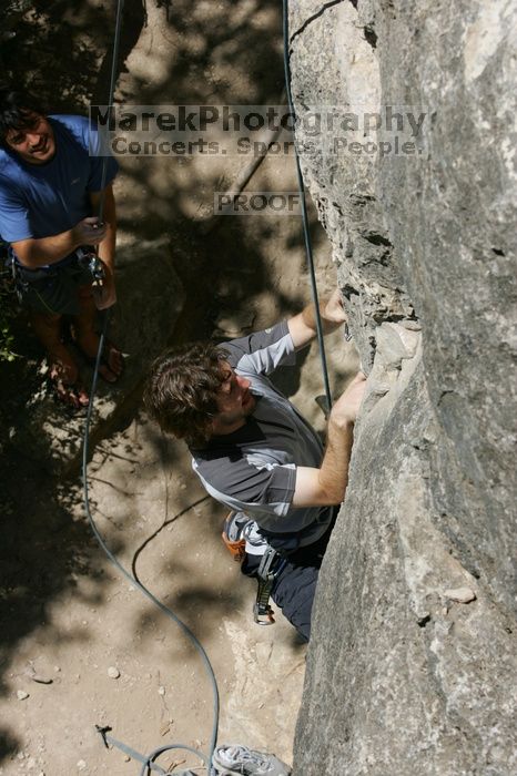 Andrew Dreher attempting the dyno while leading Lick the Window (5.10c) with Javier Morales belaying, shot from the top of Ack! (5.11b, but using the crack for the start instead) that I top roped up with my camera on my back.  It was another long day of rock climbing at Seismic Wall on Austin's Barton Creek Greenbelt, Sunday, April 5, 2009.

Filename: SRM_20090405_13171835.jpg
Aperture: f/9.0
Shutter Speed: 1/500
Body: Canon EOS-1D Mark II
Lens: Canon EF 80-200mm f/2.8 L