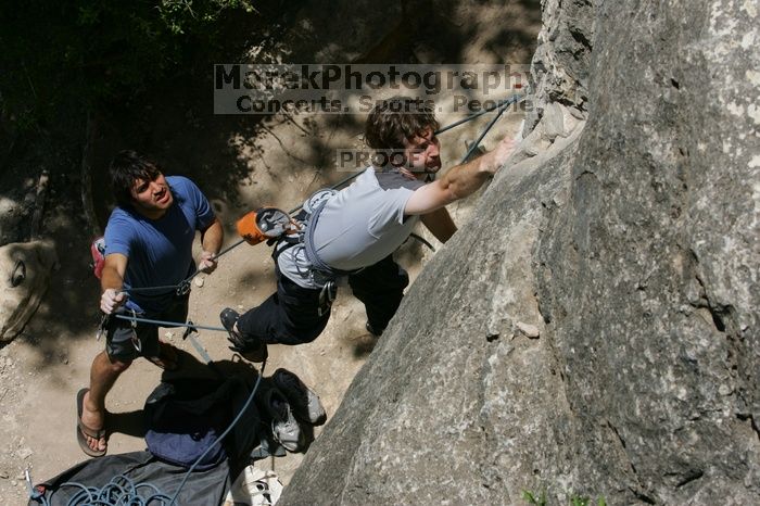 Andrew Dreher attempting the dyno while leading Lick the Window (5.10c) with Javier Morales belaying, shot from the top of Ack! (5.11b, but using the crack for the start instead) that I top roped up with my camera on my back.  It was another long day of rock climbing at Seismic Wall on Austin's Barton Creek Greenbelt, Sunday, April 5, 2009.

Filename: SRM_20090405_13212143.jpg
Aperture: f/11.0
Shutter Speed: 1/500
Body: Canon EOS-1D Mark II
Lens: Canon EF 80-200mm f/2.8 L